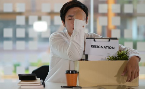 Employee turnover about to happen since sad employee has packed his things in a box and wrote his resignation letter to quit his job