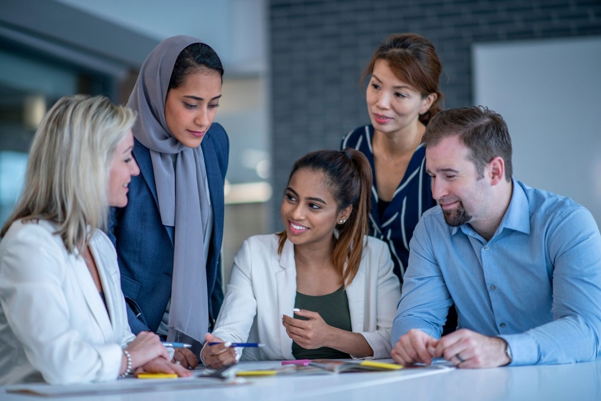HR professional talking to company members