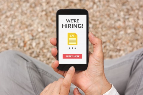 marketing for recruiters concept image where candidate gets job opportunity ad on iphone